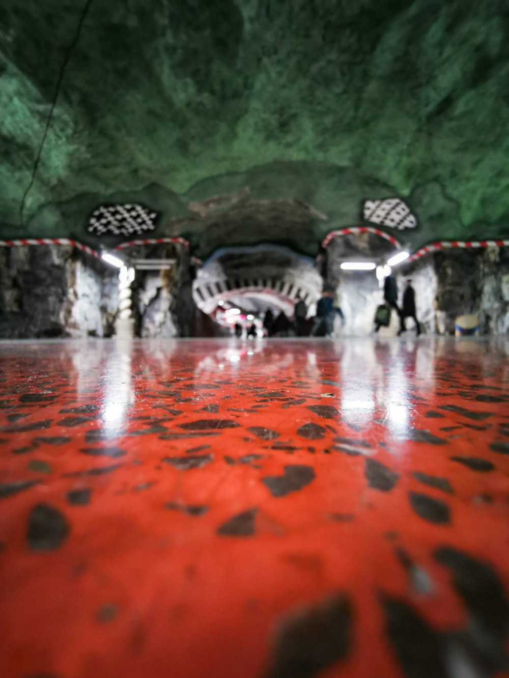 a group of people walking through a tunnel