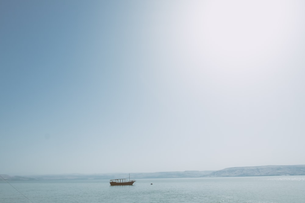 brown boats on body of water