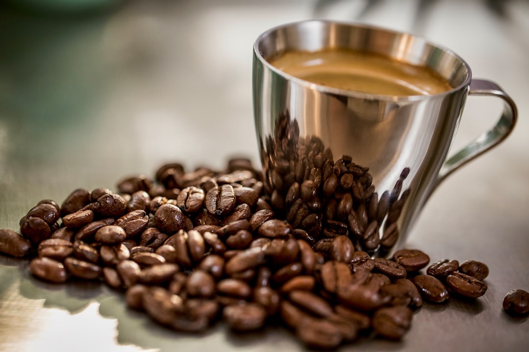 shallow focus photo of stainless steel cup