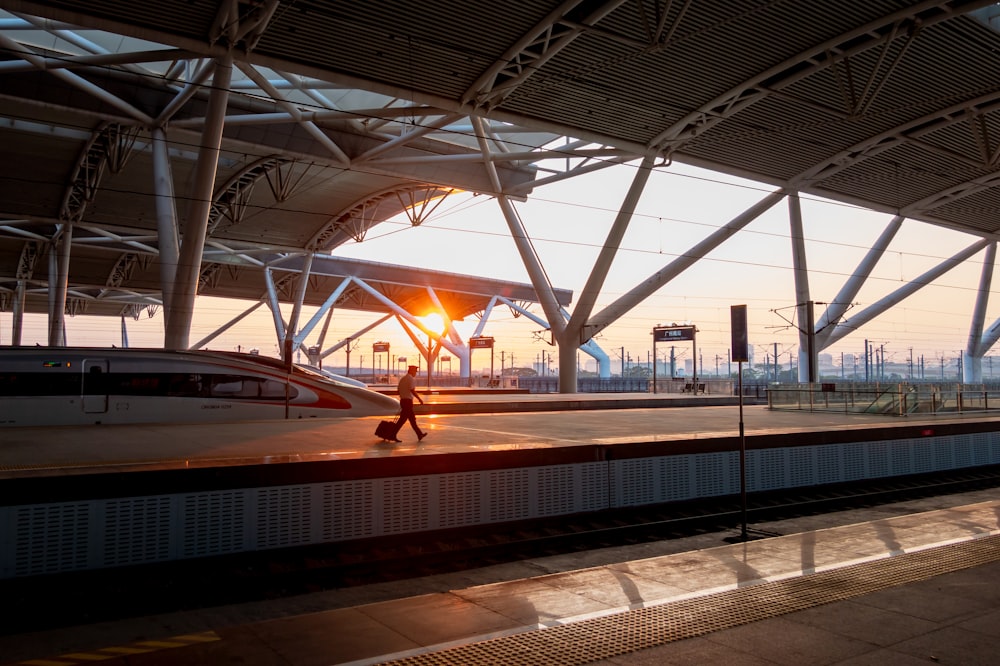 person on train station during golden hour