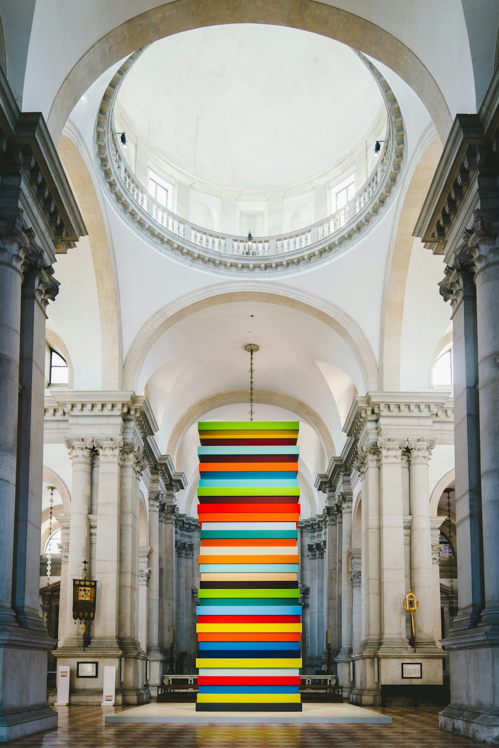 multicolored tower placed inside a museum
