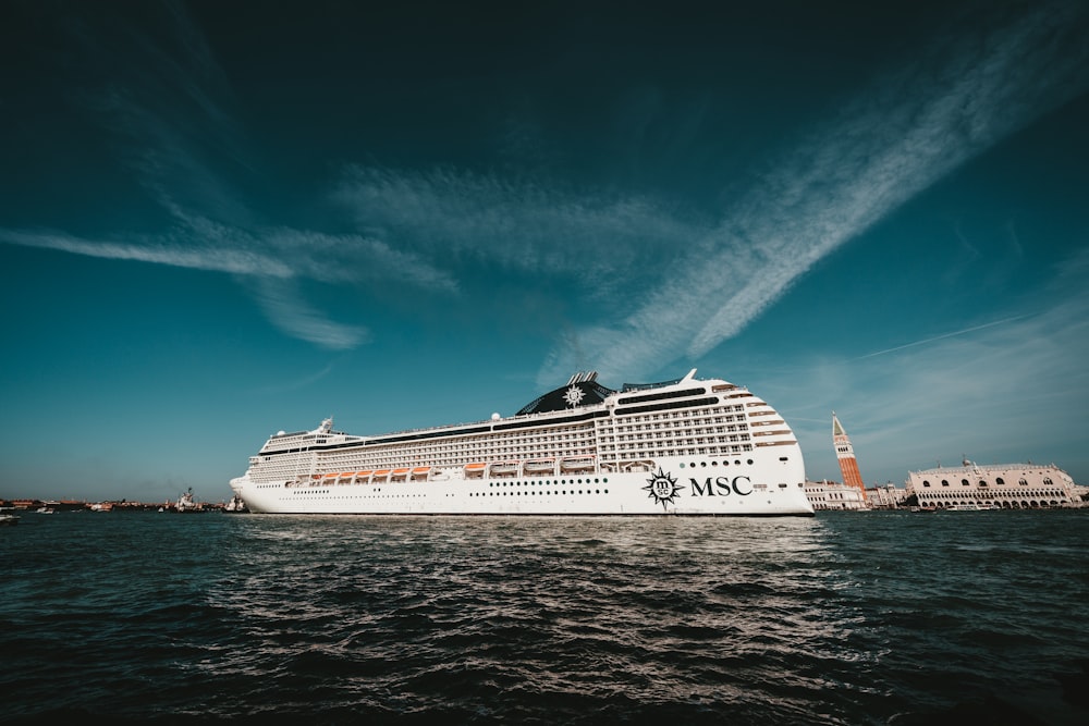 white MSC cruise ship under a blue sky