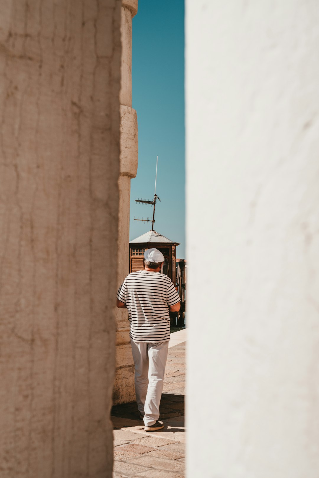 person wearing black and white striped crew-neck shirt