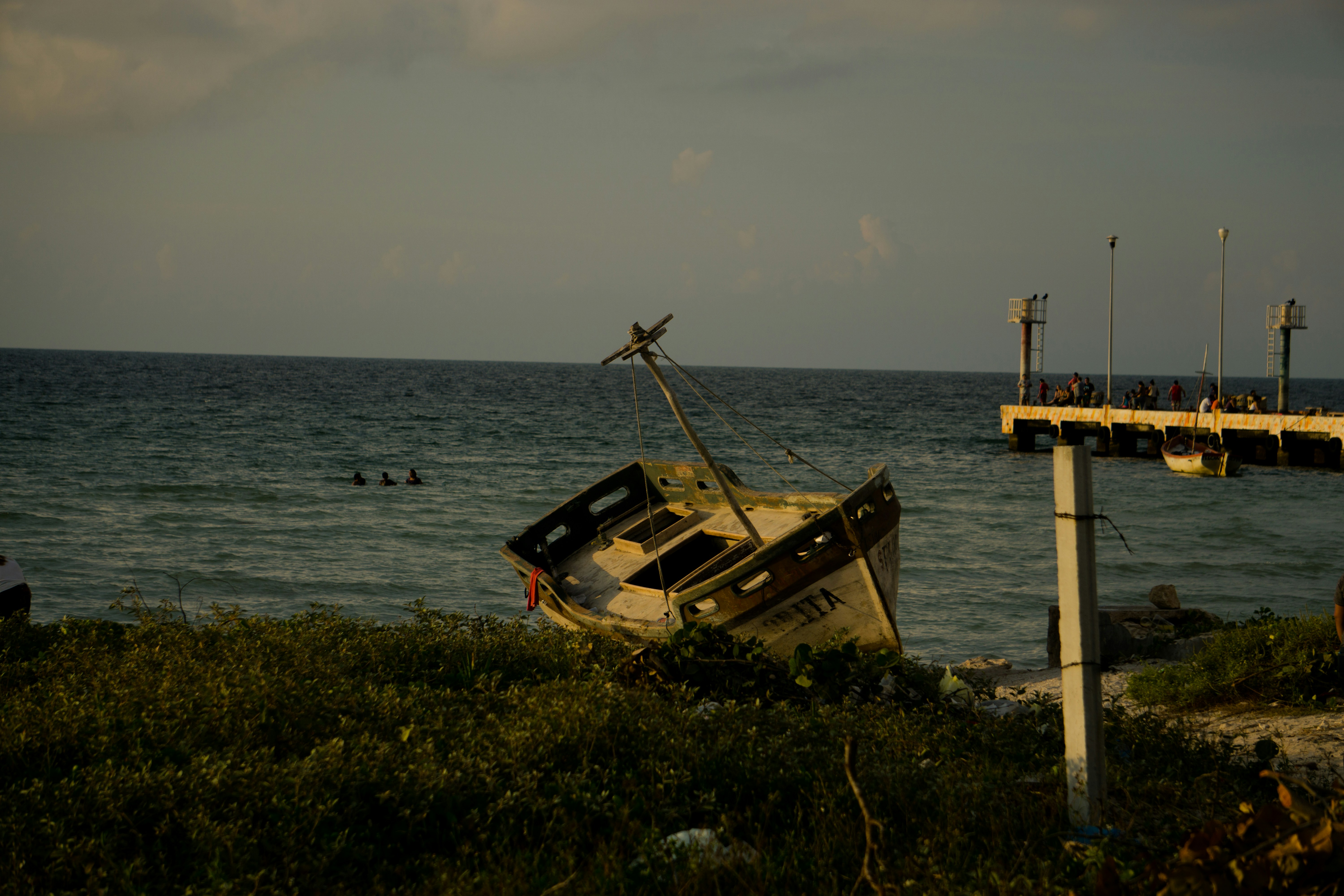 beige boat near shore