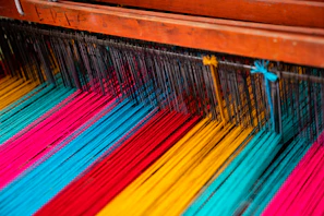 Close-up of colorful silk threads arranged for textile crafting.