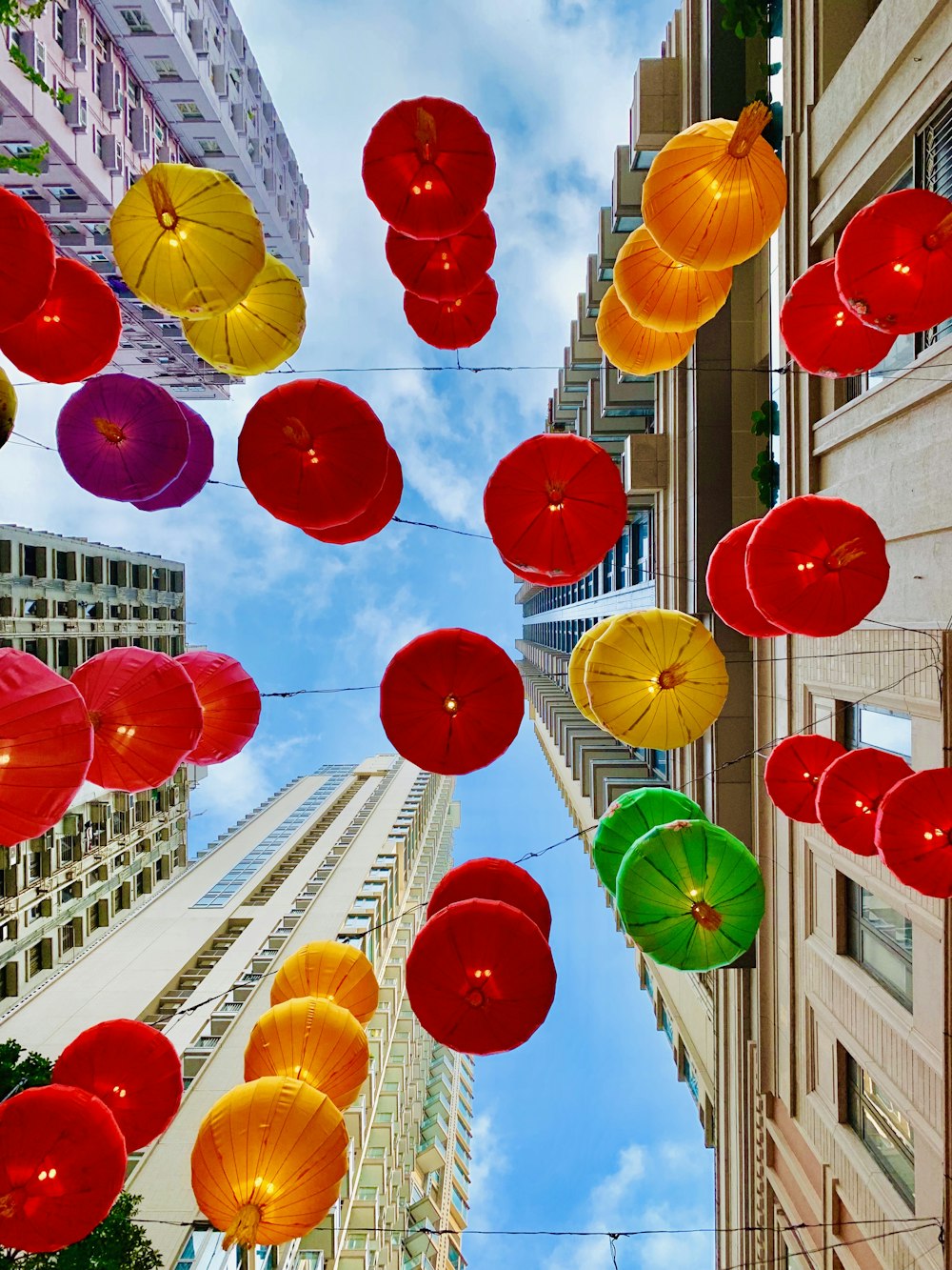 assorted color umbrellas near building