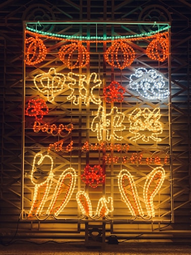 A collection of colorful neon letters and shapes.