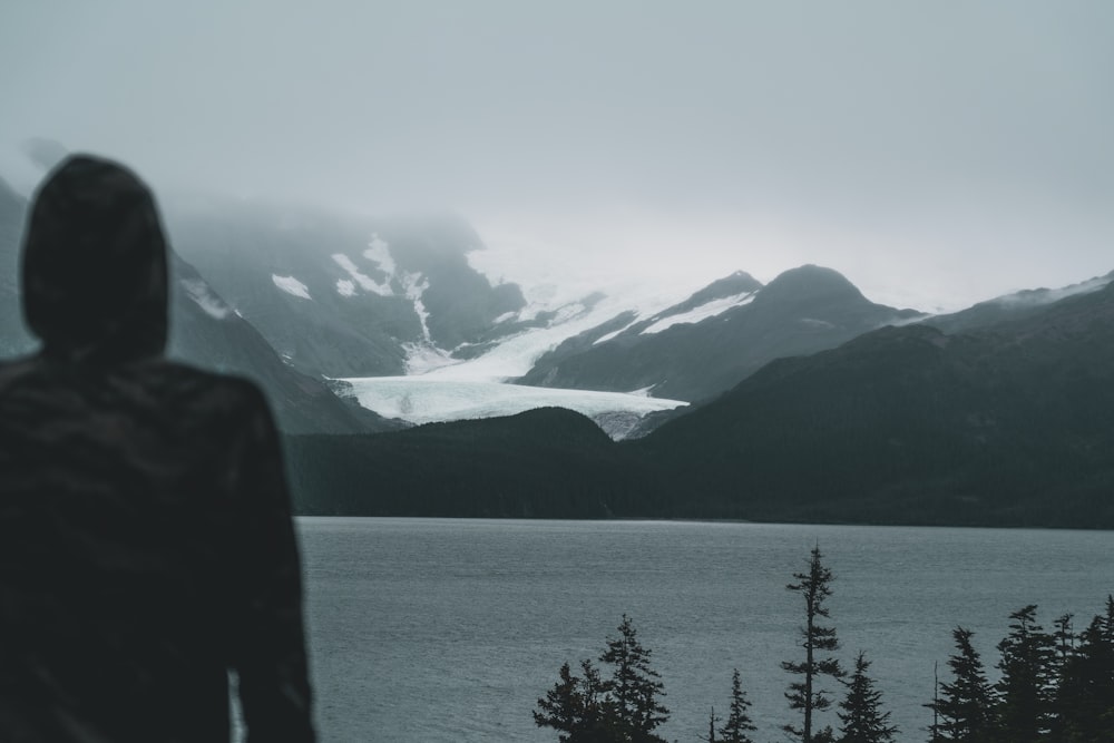 body of water beside mountains