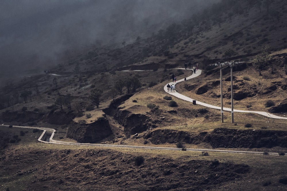 aerial photography of winding roads in the mountain