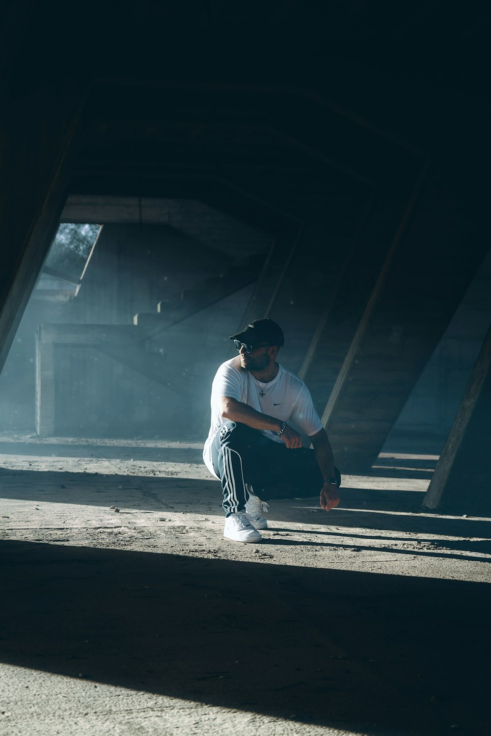 man sitting on a parking lot