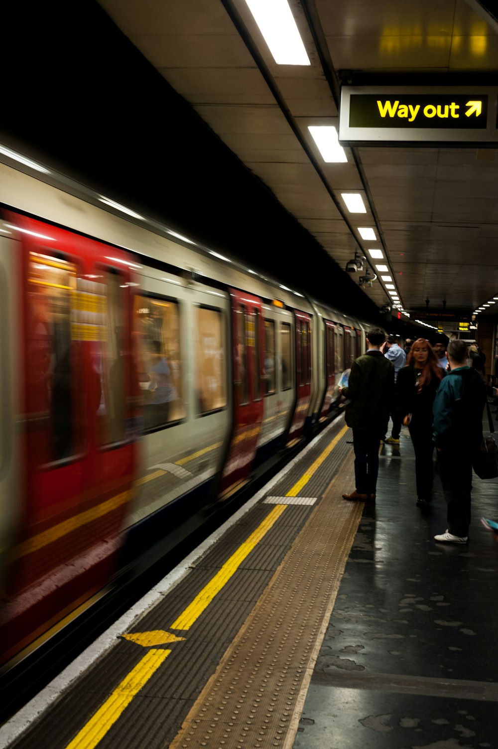 people waiting on a train station