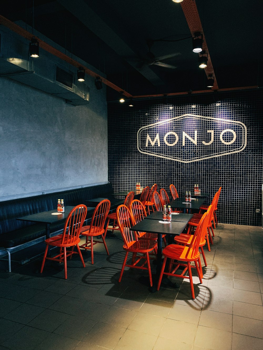 empty Monjo tables and chairs