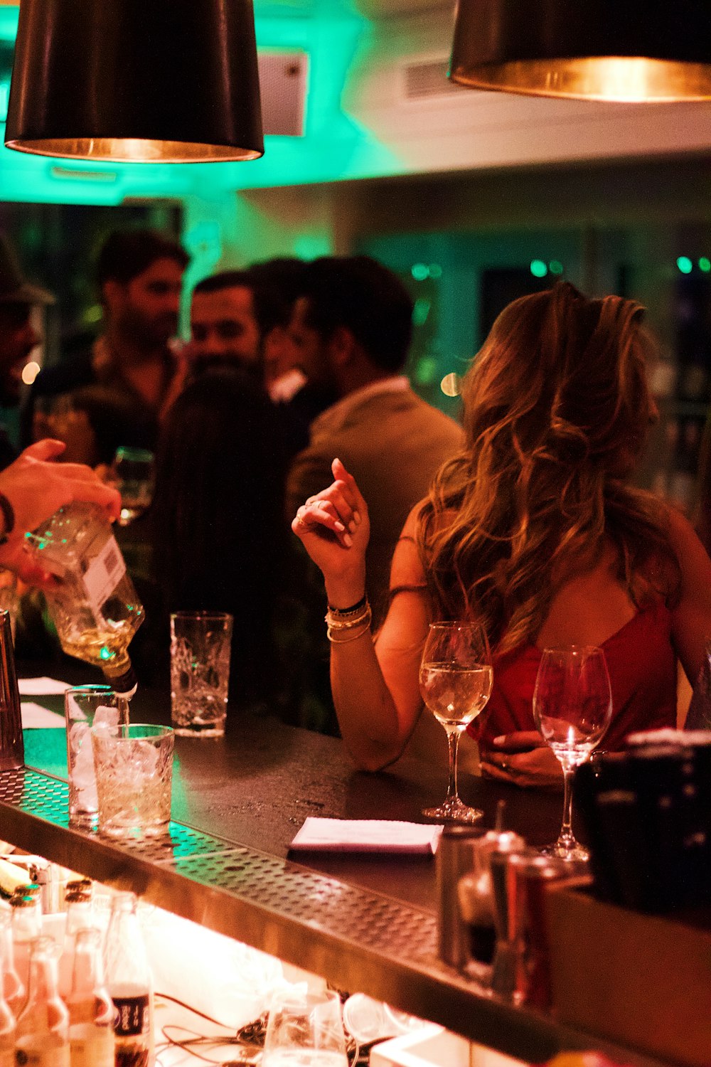 woman sits on the bar