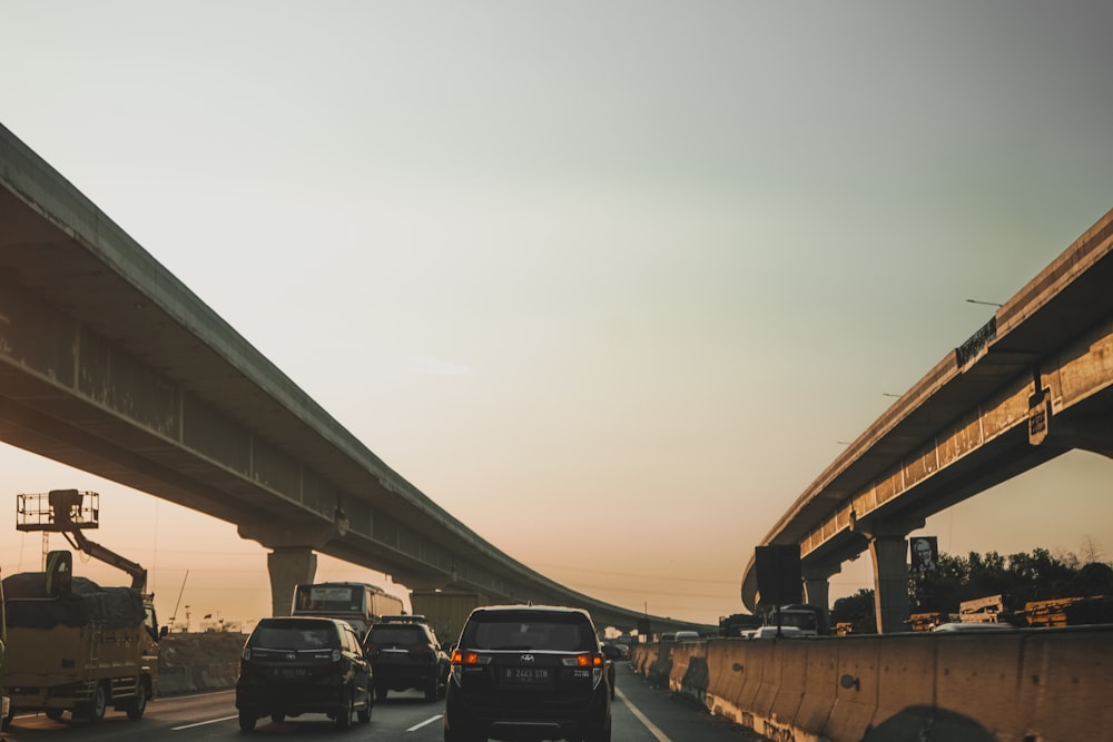 vehicles passing by a road during daytime