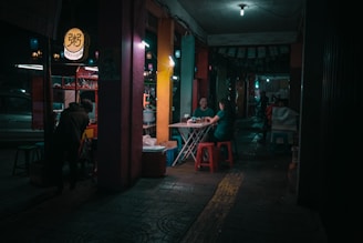two red plastic stool chairs