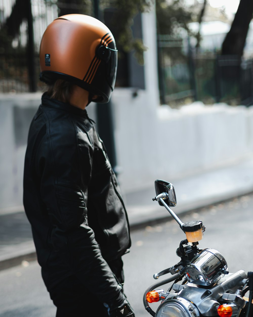 person wears brown crash helmet