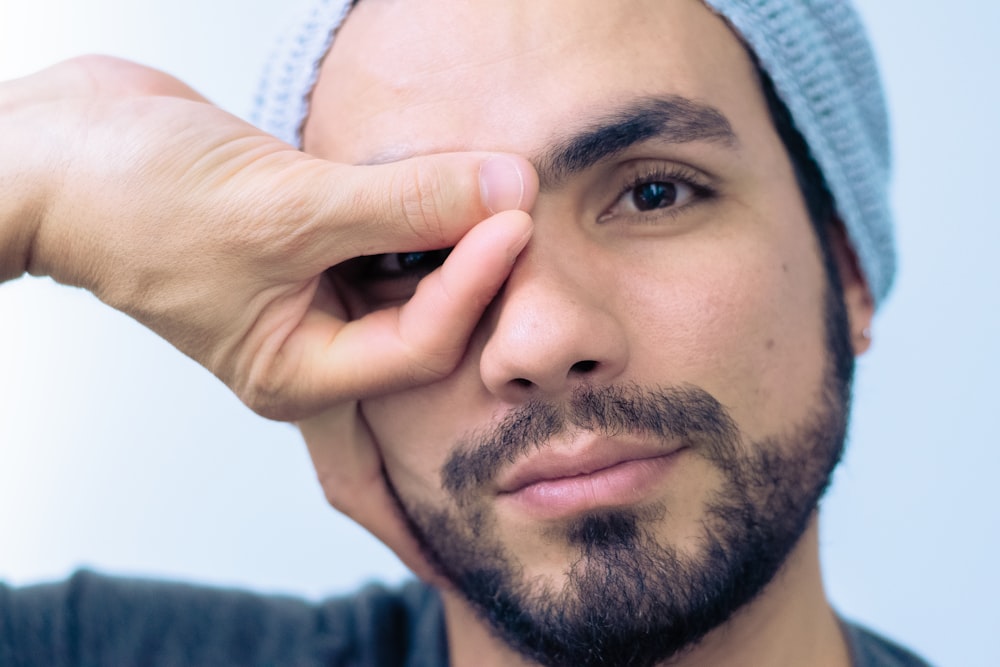 man wears blue knit cap