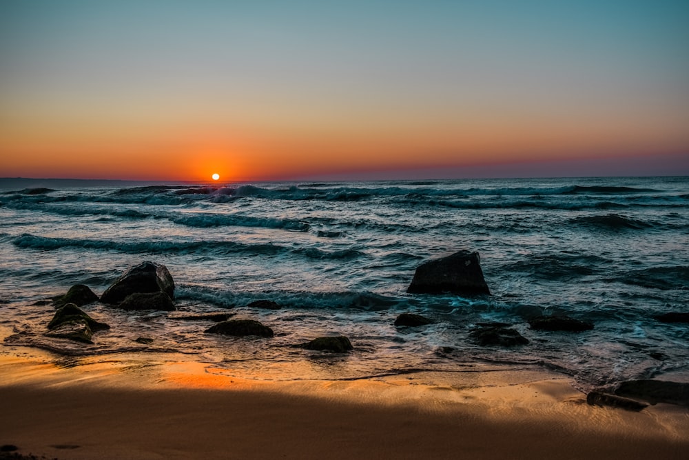 sea waves during sunset