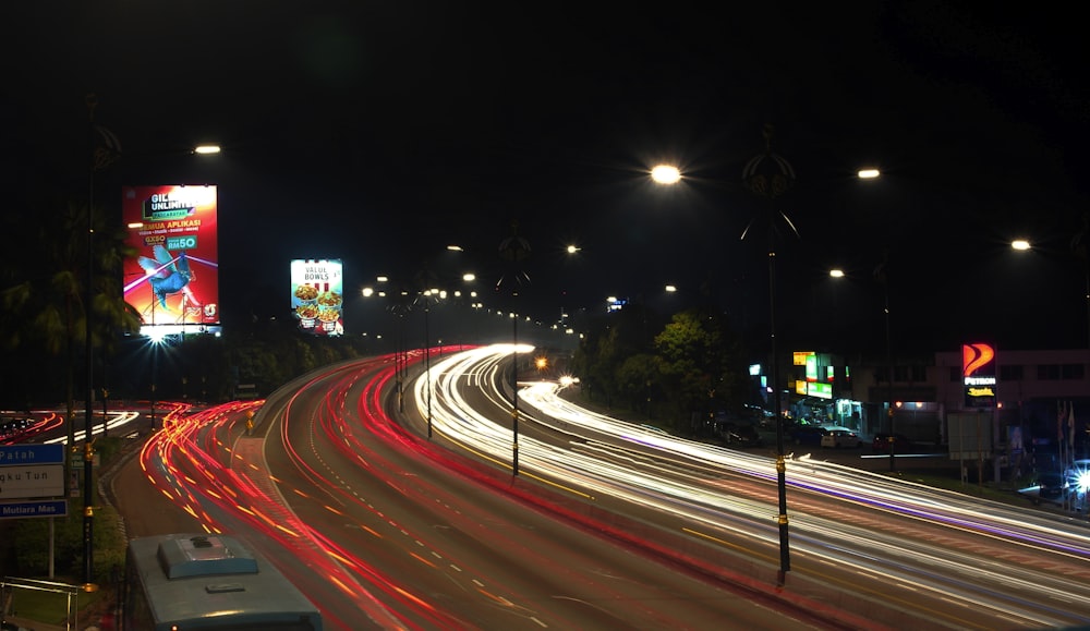 time-lapse photography of moving vehicles at night