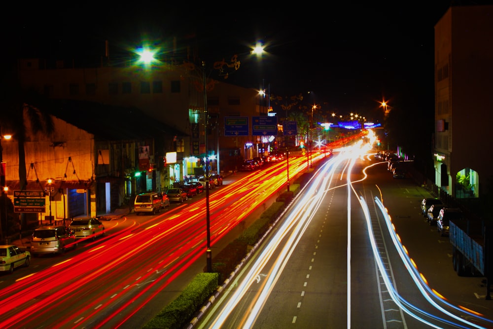 time lapse of photo cars passing by during nighttime