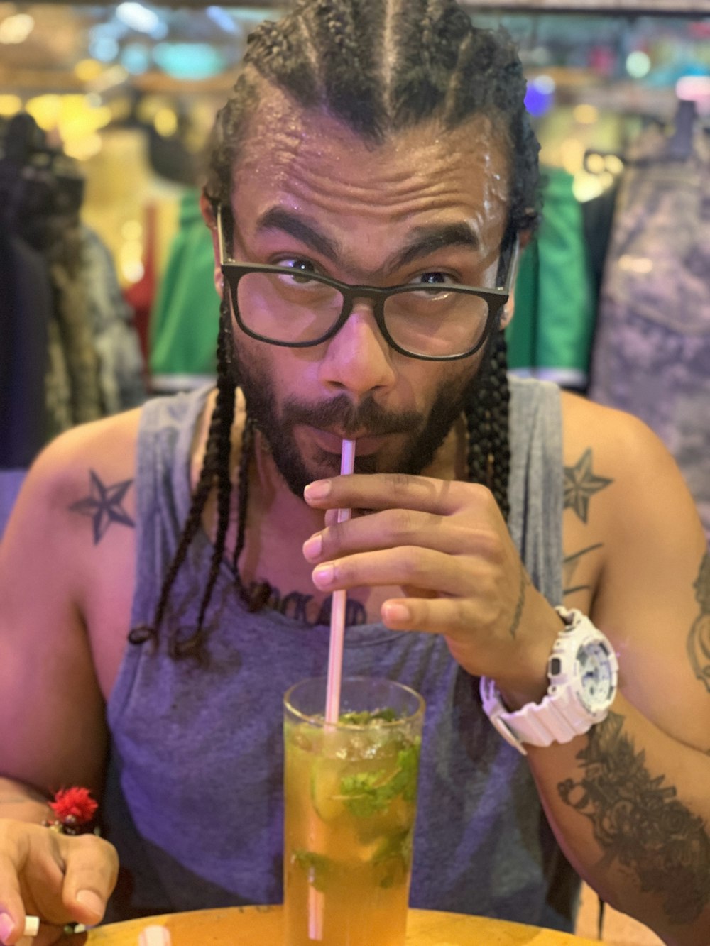 man in gray tank top wearing eyeglasses with black frames