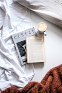 cup of coffee beside open book