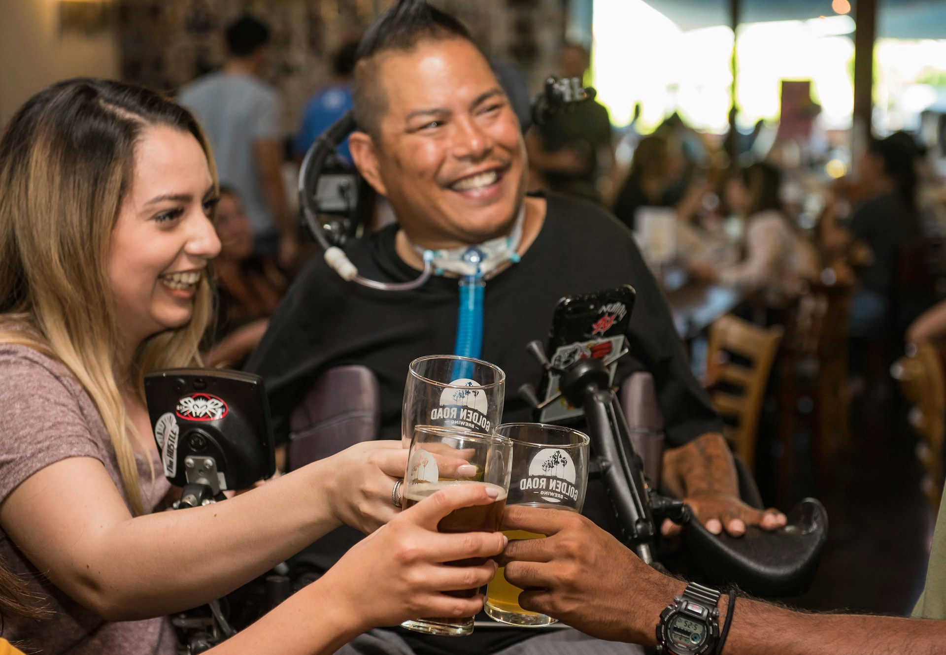 A group of friends cheering and clinking glasses in a vibrant nightlife setting.