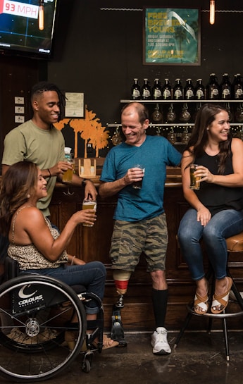customers with disabilities enjoying drinks with friends