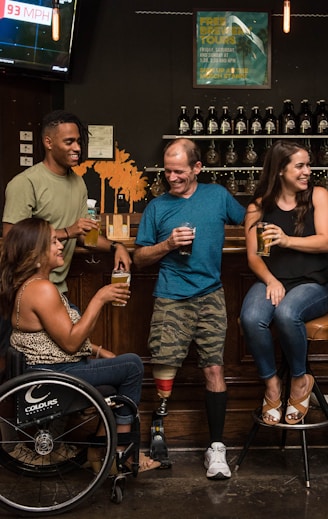 customers with disabilities enjoying drinks with friends