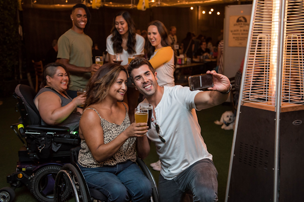 A warm group photo of members at a social event.