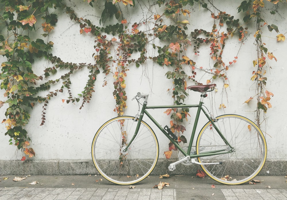 black bike beside wall