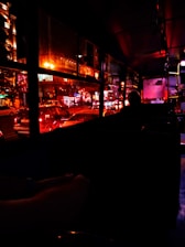 people inside the store near the window at nighttime