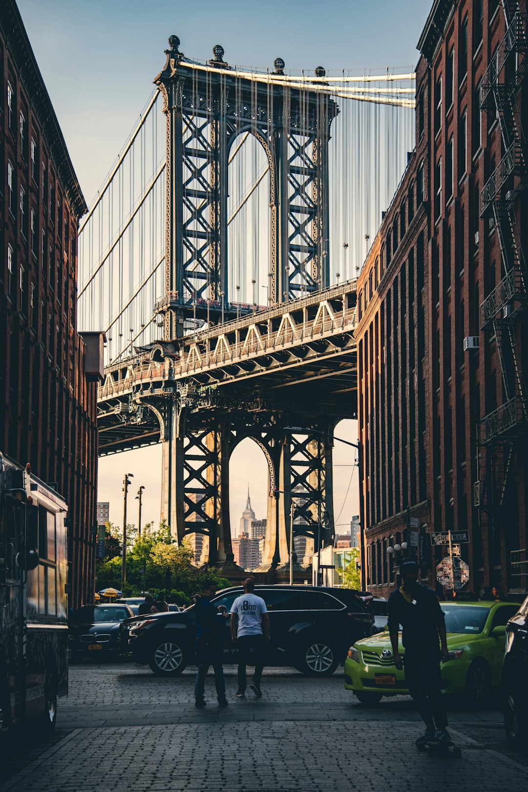 people standing beside the cars near buildings