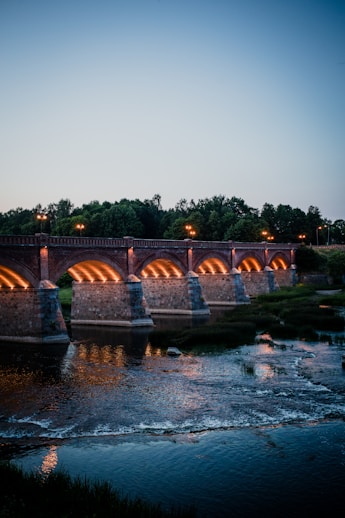 a bridge that is lit up at night