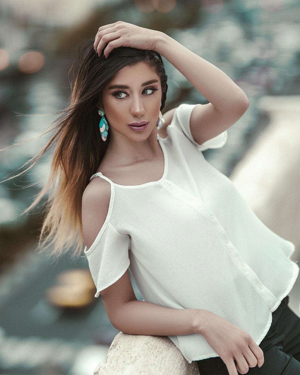 woman wears white off-shoulder blouse