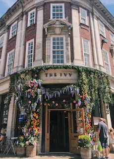 An inviting image of the preschool's entrance with blooming flowers.