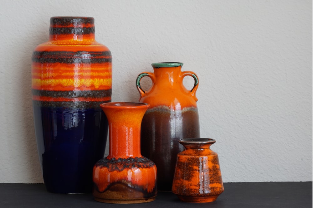 several assorted-color ceramic vases