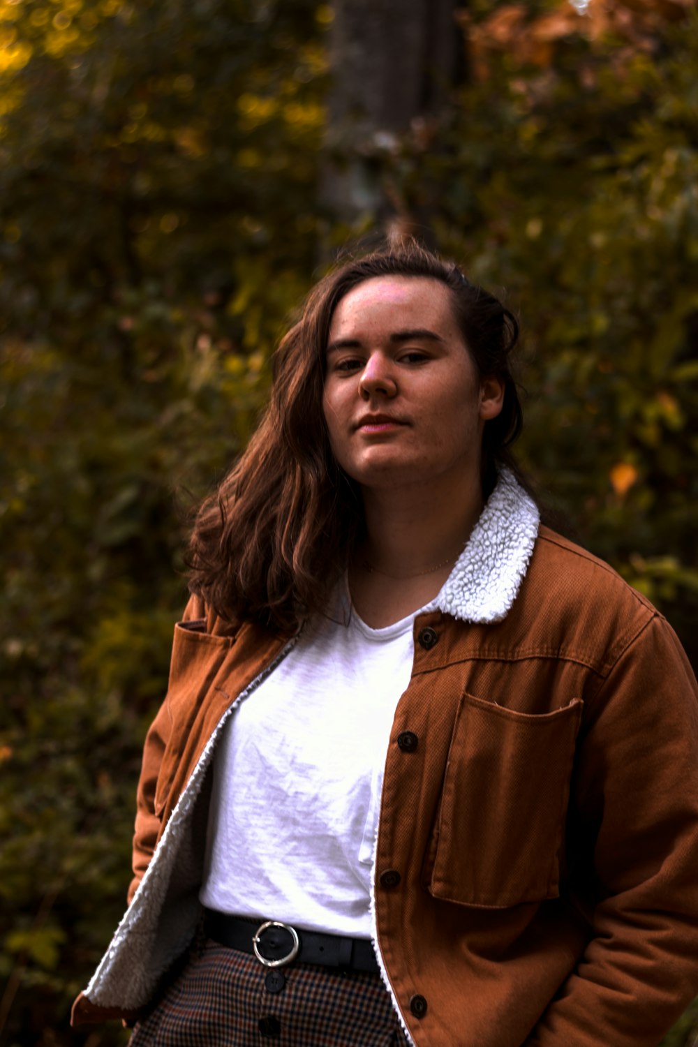 woman wearing brown jacket