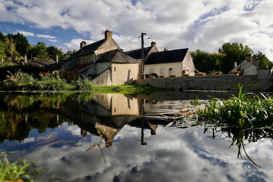 white concrete houses under cloudy sky