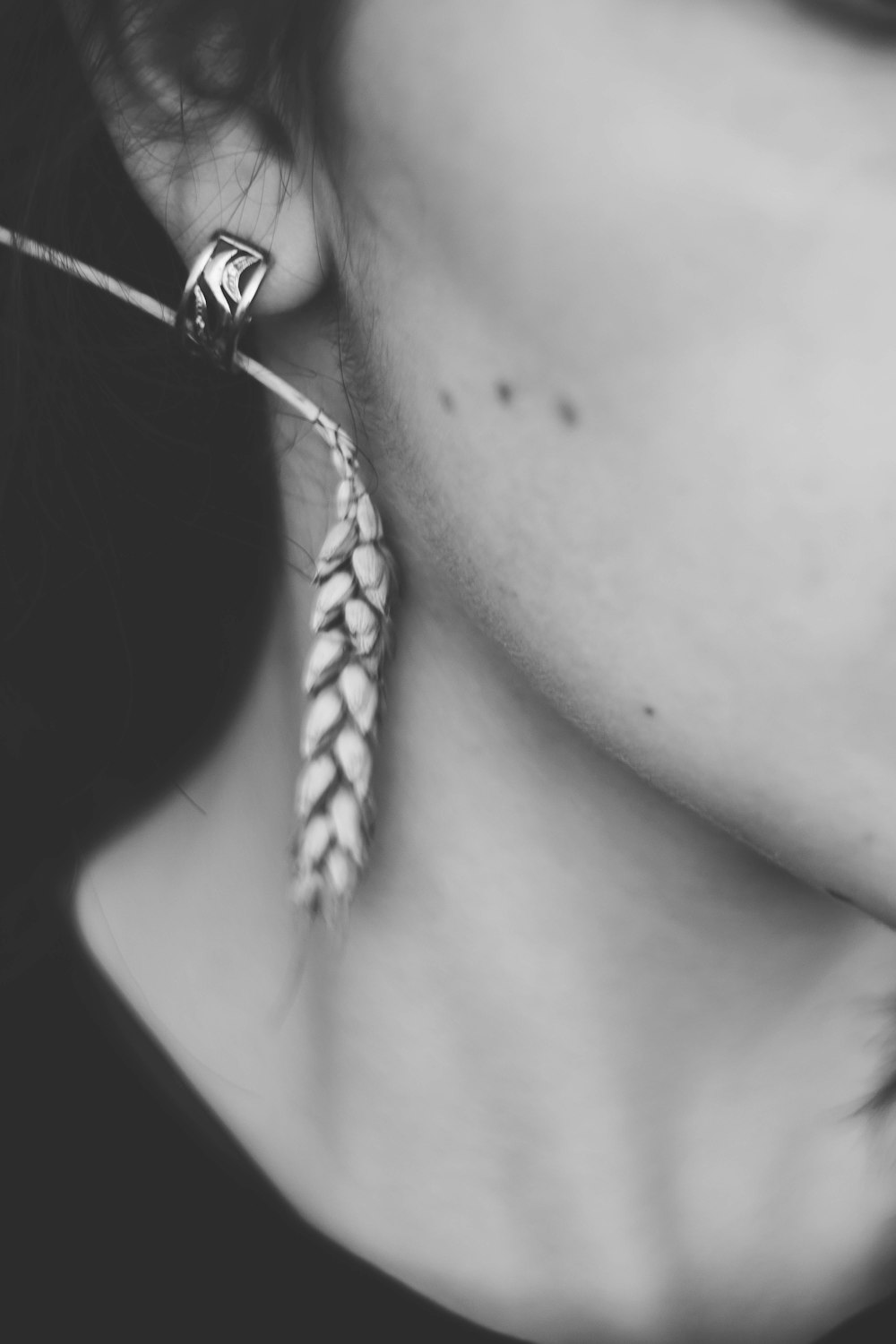 silhouette photography of woman wearing earring