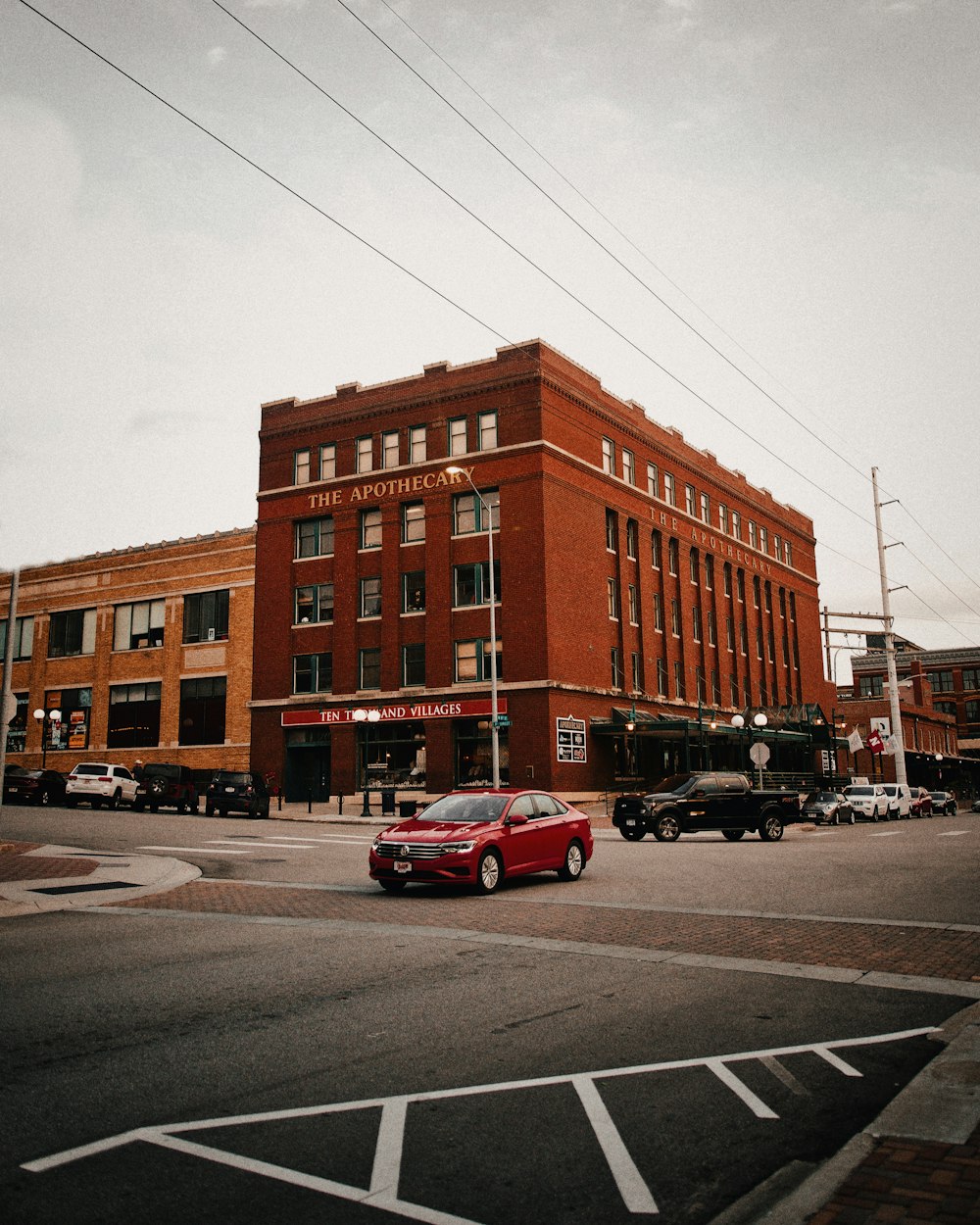 red sedan on road during daytime