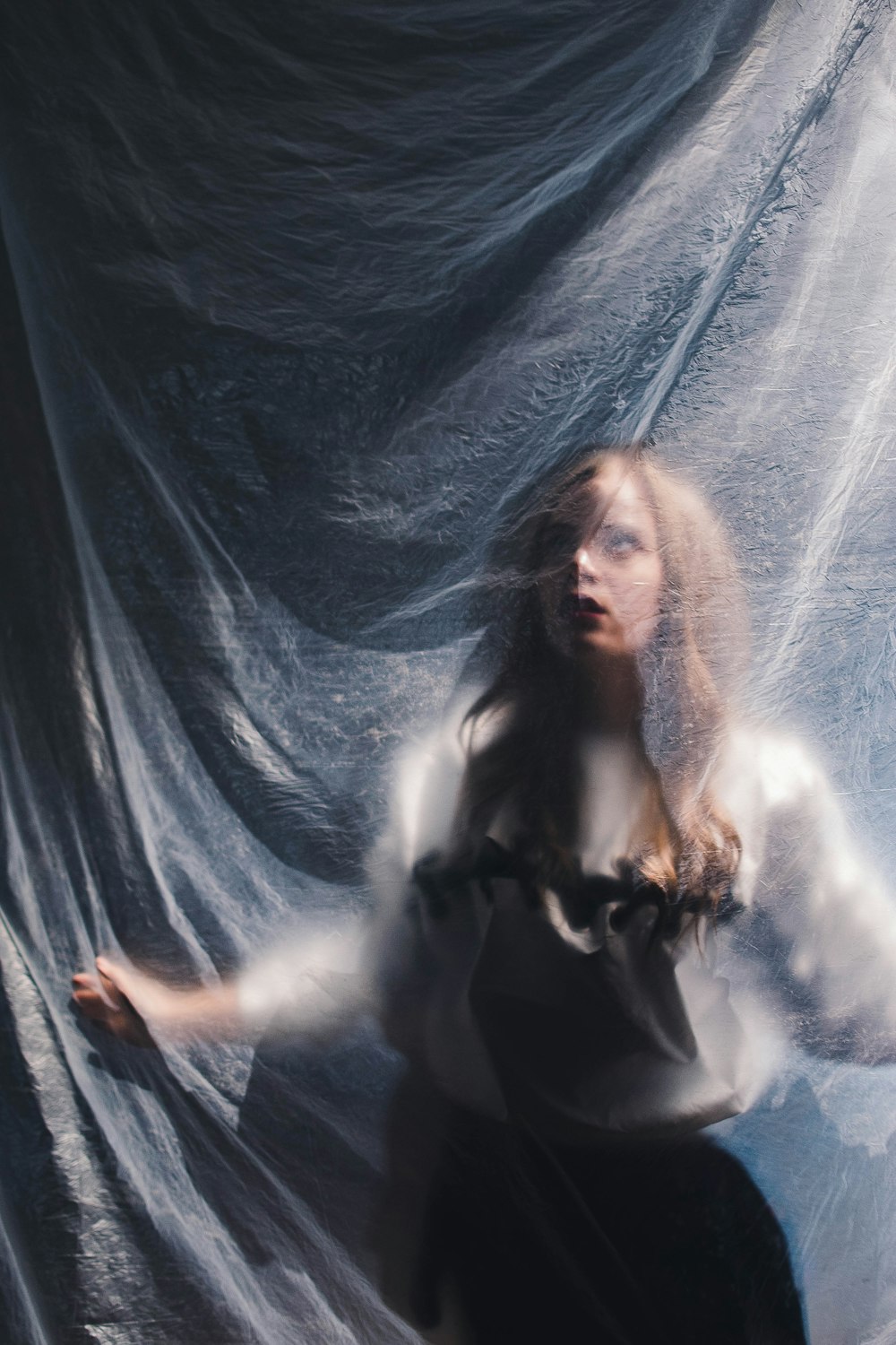 woman wearing white long-sleeved top