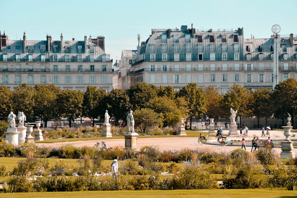 statue surrounded by trees during daytime