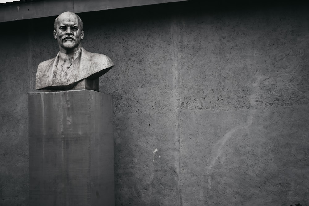 grayscale photography of man headbust