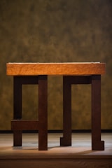 A sturdy dining table crafted from rich wood.