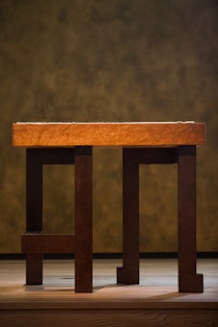 A sturdy dining table crafted from rich wood.