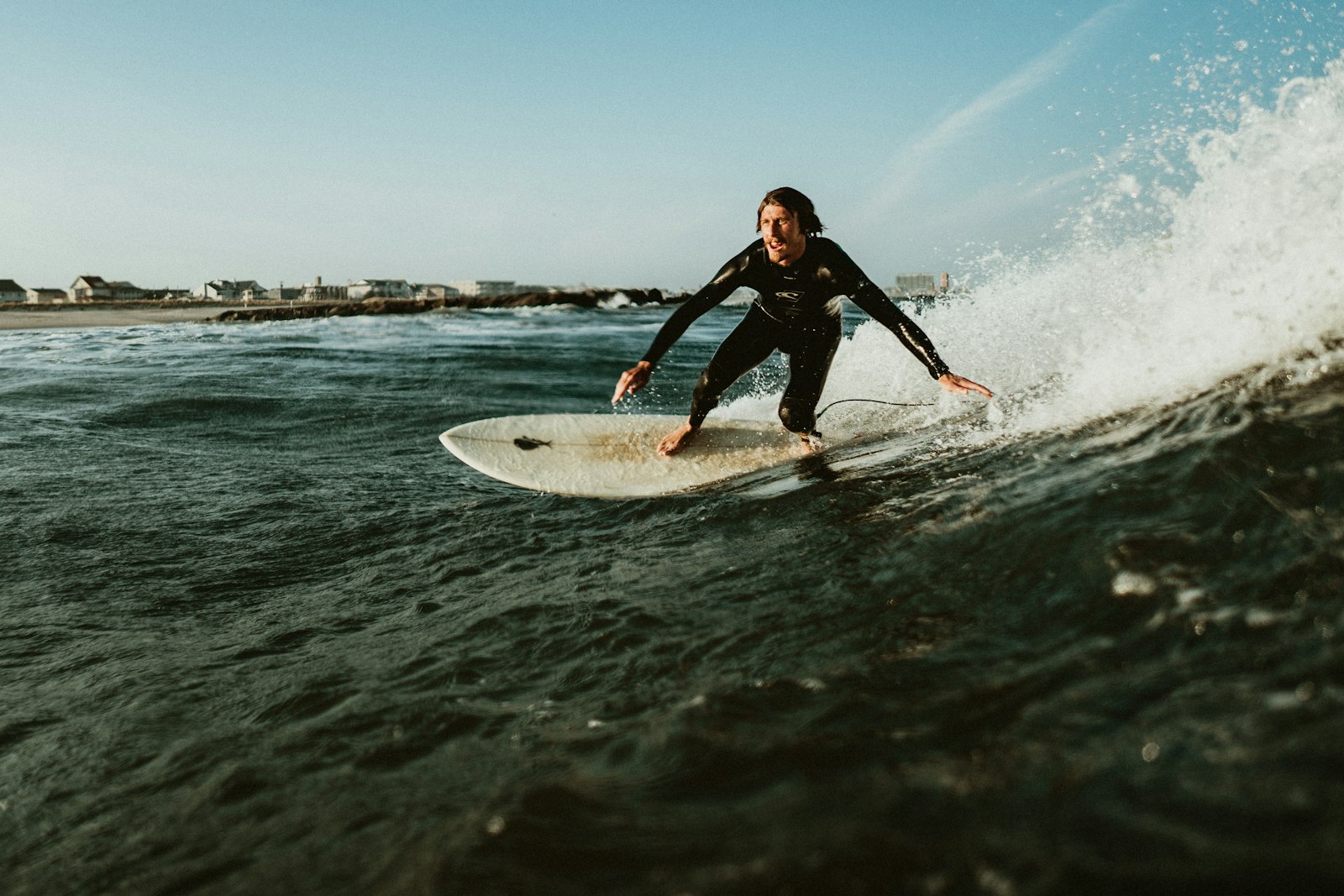 ZEISS Batis 25mm F2 sample photo. Man playing surfboarding during photography