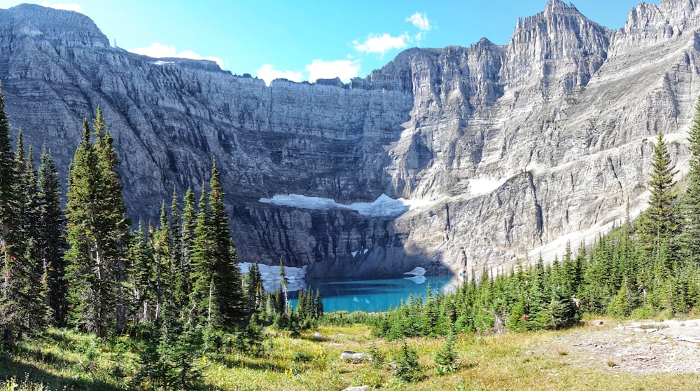 wide-angle photography of lake and mountain range during daytime