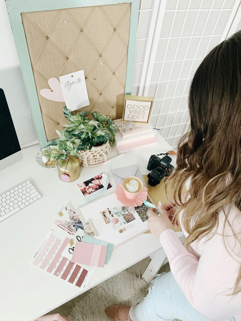 pink and white cards and photos