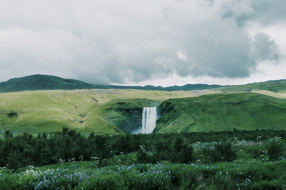 wide-angle photography of waterfalls during daytime